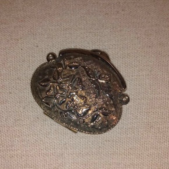 Jewelry - Butterfly motif metal purse pendant.